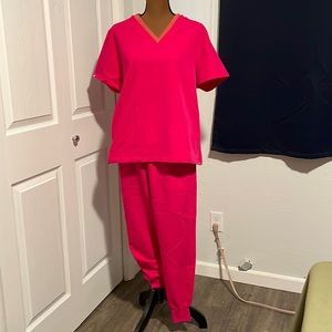 Lovingly used FIGS in Ultra Rose with Terracotta trim and vice versa